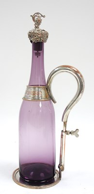 Lot 212 - An antique silver plated wine bottle holder,...