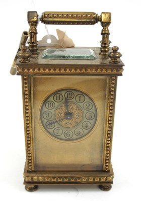 Lot 267 - A full glass brass carriage clock with key...