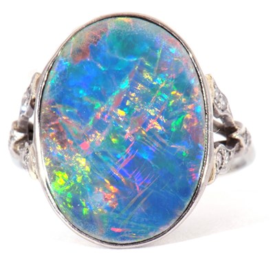 Lot 25 - Opal and diamond ring, the oval shaped flat...
