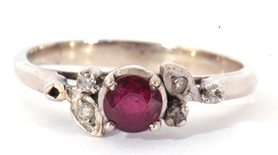Lot 36 - Precious metal, ruby and diamond ring centring...
