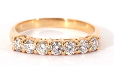 Lot 53 - Seven stone diamond ring line set with seven...