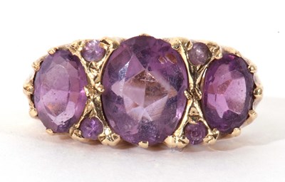 Lot 62 - 9ct gold three stone amethyst ring featuring...