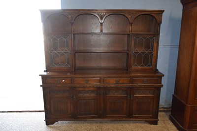 Lot 213 - A reproduction Old Charm oak dresser with lead...
