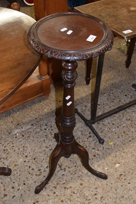 Lot 252 - A Georgian Revival dark wood jardiniere stand...