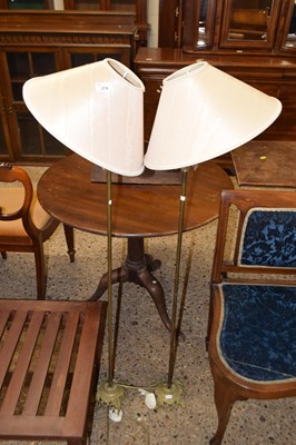 Lot 274 - A pair of brass floor standing lamps