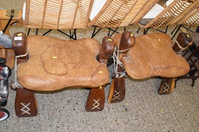 Lot 282 - A pair of hardwood framed camel stools