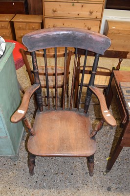 Lot 297 - A Victorian elm seat and stick back Windsor chair