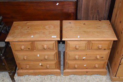 Lot 317 - A pair of modern pine four drawer bedside chests