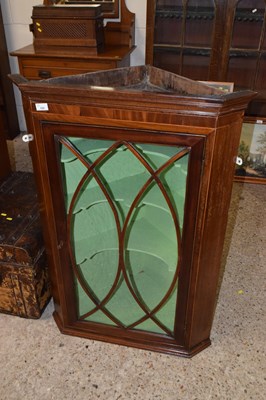 Lot 322 - A George III mahogany corner cabinet with...