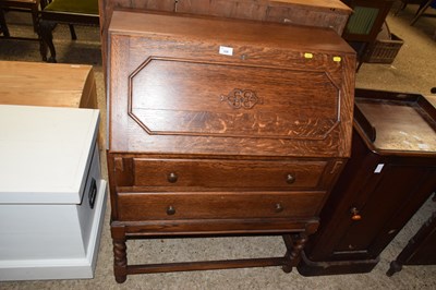 Lot 328 - An early 20th Century oak bureau