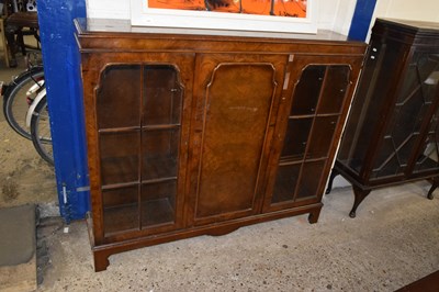Lot 333 - A 20th Century walnut veneered bookcase...