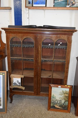 Lot 342 - An early 20th Century oak bookcase cabinet