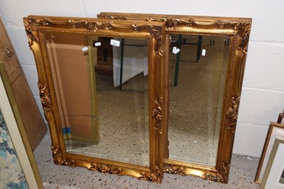 Lot 231 - A pair of rectangular bevelled wall mirrors in...