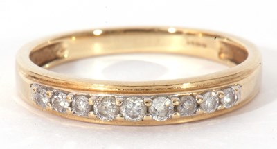 Lot 102 - Modern 9ct gold and diamond half hoop ring,...