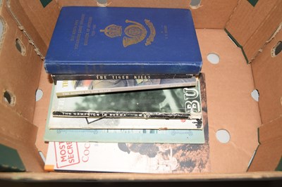 Lot 520 - A box of various military related books to...