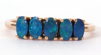 Lot 109 - Modern 9ct gold black opal doublet five stone...