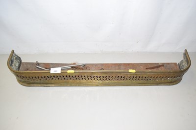 Lot 620 - A small brass fire curb and fire tools