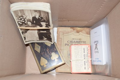 Lot 628 - A box of various postcards, playing cards etc