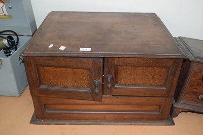 Lot 659 - An early 20th Century three dial radio housed...