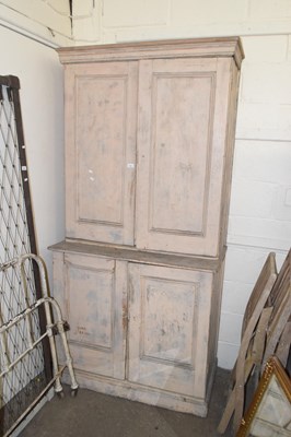 Lot 665 - A painted pine four door cupboard for restoration