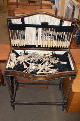 Lot 667 - An early 20th Century oak cutlery canteen...