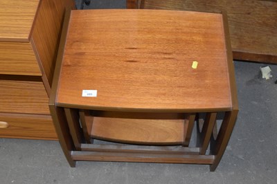 Lot 695 - A nest of teak finish tables