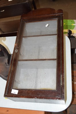 Lot 702 - A small glazed display cabinet