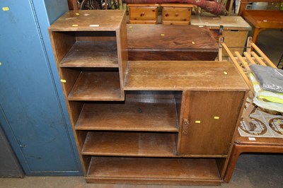 Lot 711 - A vintage oak bookcase cabinet