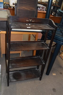 Lot 727 - A dark wood four tier bookcase
