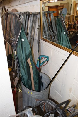 Lot 790 - A metal dustbin containing a fishing umbrella,...