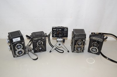 Lot 592 - A group of vintage cameras comprising a Rollei...