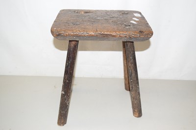 Lot 197 - An elm topped milking stool