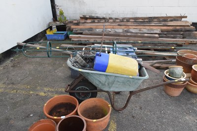 Lot 347 - A wheelbarrow containing plant support,...
