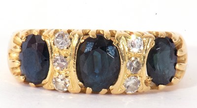 Lot 153 - Sapphire and diamond ring featuring three...
