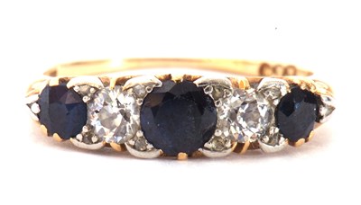 Lot 163 - Sapphire and diamond ring featuring three...