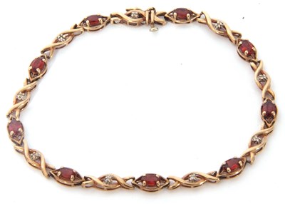 Lot 215 - Modern 9ct gold and garnet small diamond line...