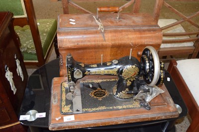 Lot 330 - VINTAGE JONES SEWING MACHINE IN WOODEN CASE
