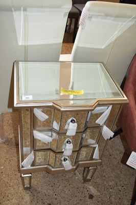Lot 385 - RYLEY THREE DRAWER MIRRORED BEDSIDE TABLE,...