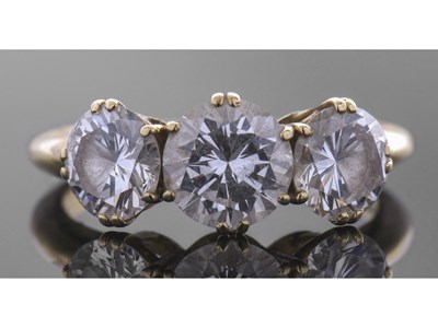 Lot 162 - Three stone diamond ring featuring three round...