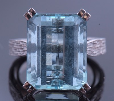 Lot 165 - Large aquamarine dress ring of stepped cut, 15....