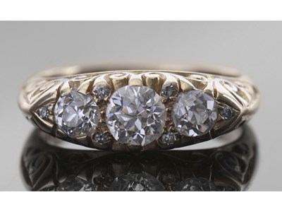 Lot 167 - Diamond three stone ring centring a round old...