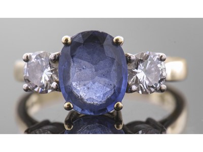 Lot 168 - 18ct gold sapphire and diamond three stone...