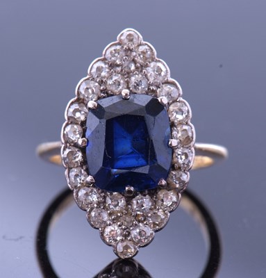 Lot 170 - Sapphire and diamond lozenge ring, the faceted...
