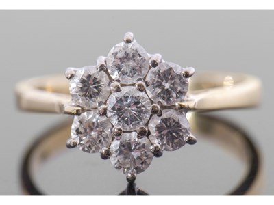 Lot 185 - Diamond cluster ring featuring seven round...