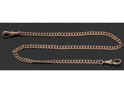Lot 217 - 9ct gold curb link chain suspending two clips...