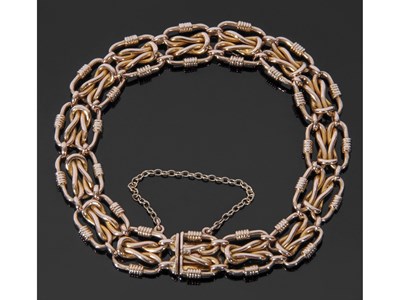 Lot 229 - 585 stamped bracelet, a design featuring 15...