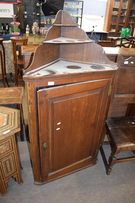 Lot 326 - George III oak corner cabinet with graduated...