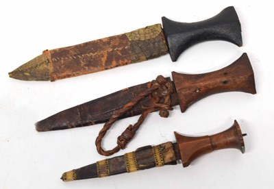 Lot 161 - Three North African daggers/knives with carved...