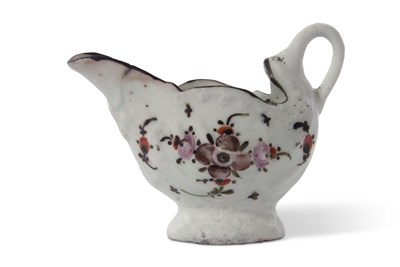 Lot 78 - A Lowestoft porcelain dolphin ewer decorated...