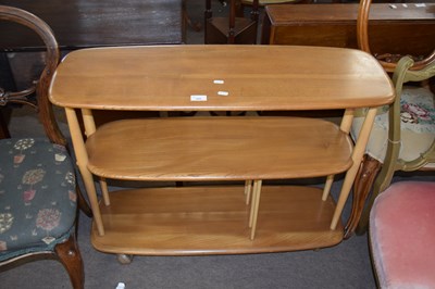 Lot 388 - Ercol light elm three tier shelf unit or room...